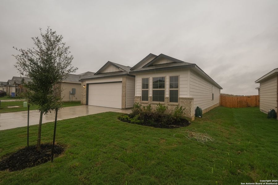 Front exterior of a new home in Greenspoint Heights, Seguin, TX, highlighting curb appeal (Image 20).
