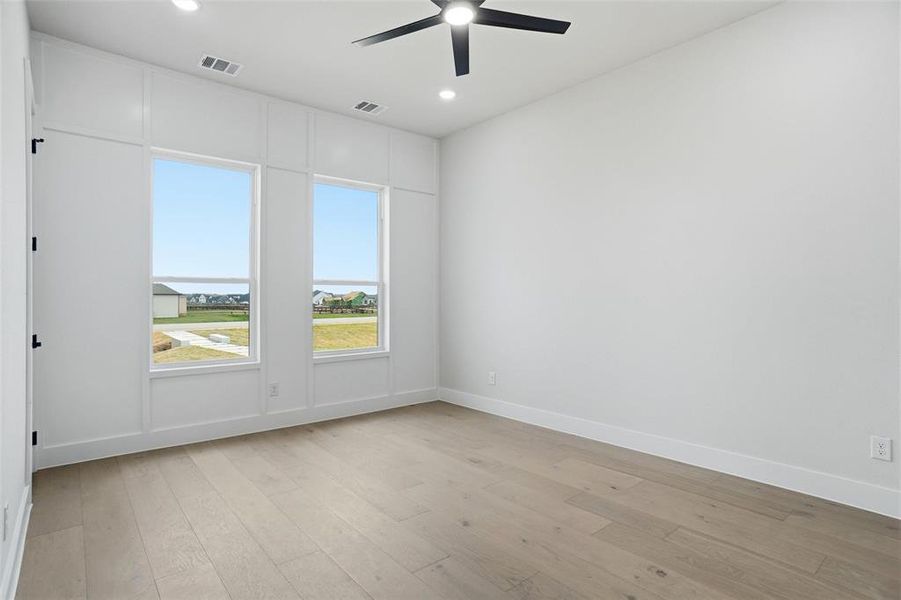 Spacious secondary bedroom with ensuite bathroom and walk-in closet.