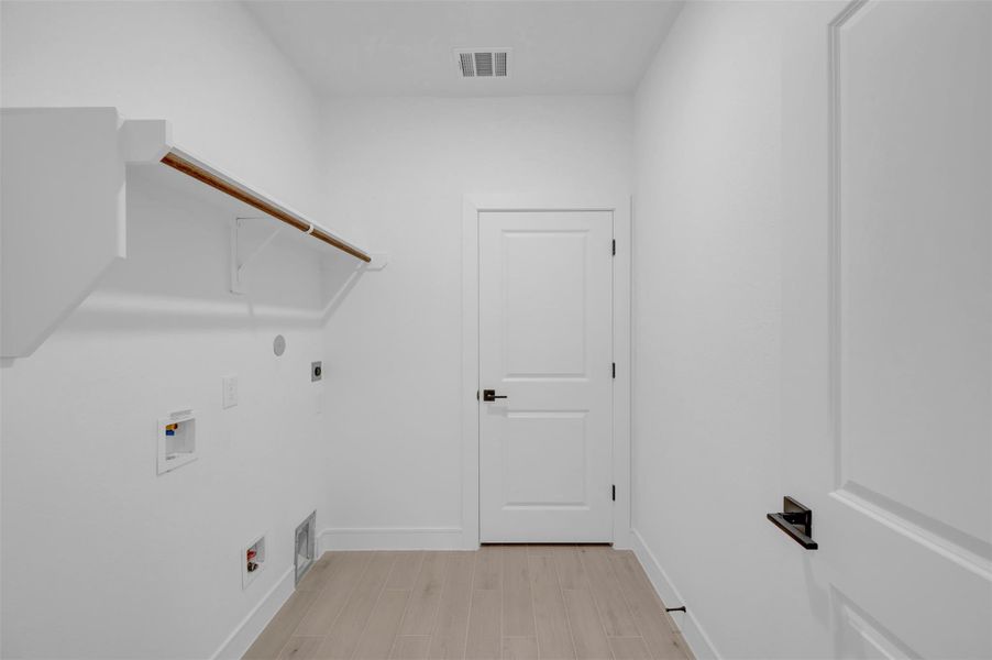 Laundry room (*Photo not of actual home and used for illustration purposes only.)