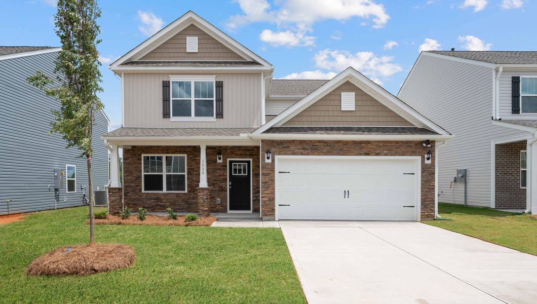 Front exterior of a new home in Sage Grove, Lyman, SC, highlighting curb appeal (Image 1). Front exterior of a new home in Sage Grove, Lyman, SC, highlighting curb appeal (Image 1).