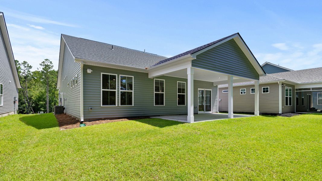 Front exterior of a new home in Bluffs at Sun Colony, Longs, SC, highlighting curb appeal (Image 19).