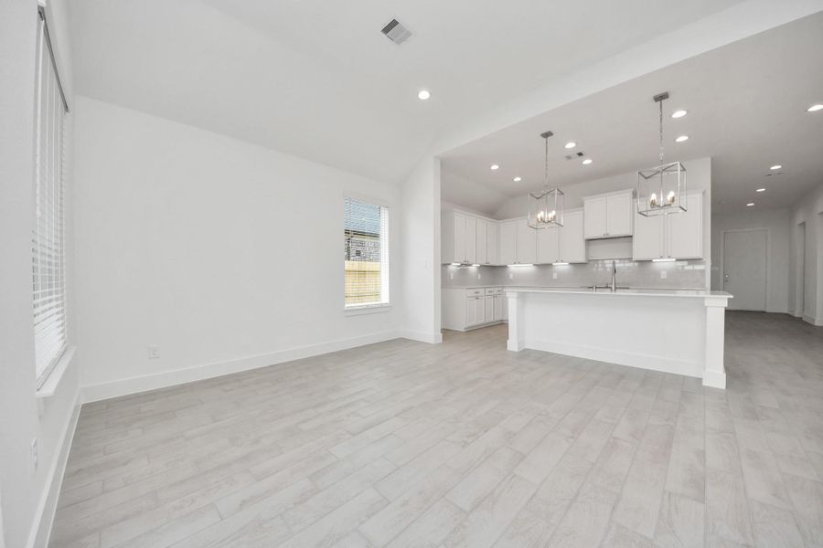 Discover another perspective of this stunning kitchen, generously appointed with an abundance of counter space Discover another perspective of this stunning kitchen, generously appointed with an abundance of counter space
