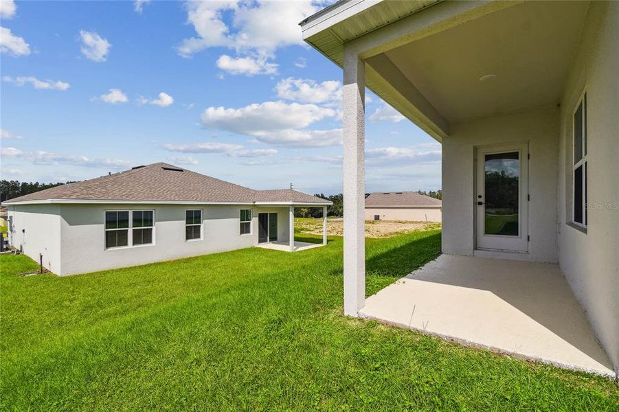 Exterior details and patio area of a home in Aspire at The Pines, Dunnellon (Image 3).