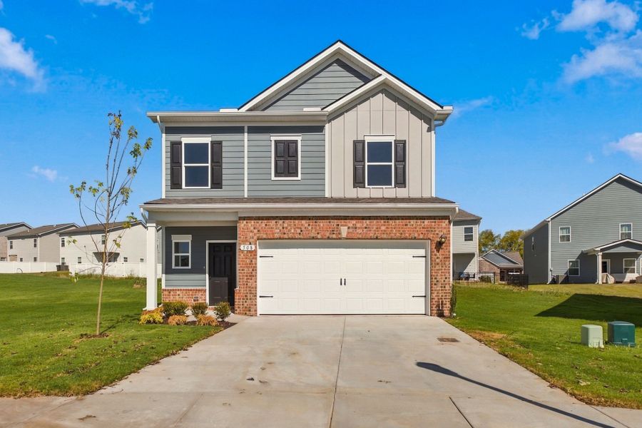 Front exterior of a new home in Winston Place, Gallatin, TN, highlighting curb appeal (Image 1). Front exterior of a new home in Winston Place, Gallatin, TN, highlighting curb appeal (Image 1).