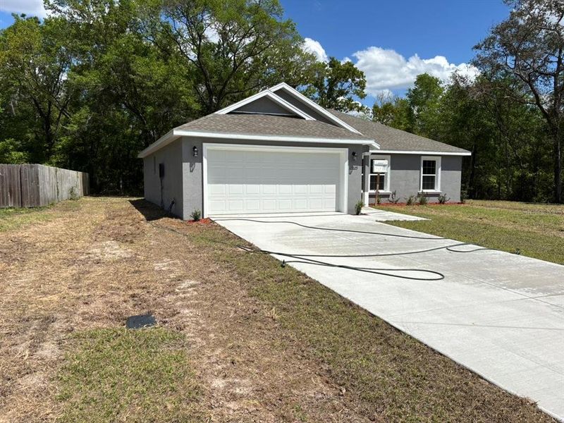 Front exterior of a new home in , Dunnellon, FL, highlighting curb appeal (Image 2). Front exterior of a new home in , Dunnellon, FL, highlighting curb appeal (Image 2).