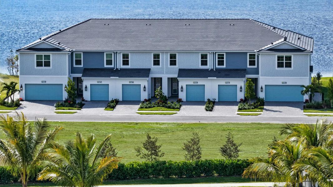 Front exterior of a new home in SkySail Real Estate and Homes for Sale in Naples, FL - Neal Communities, Naples, FL, highlighting curb appeal (Image 22). Front exterior of a new home in SkySail Real Estate and Homes for Sale in Naples, FL - Neal Communities, Naples, FL, highlighting curb appeal (Image 22).