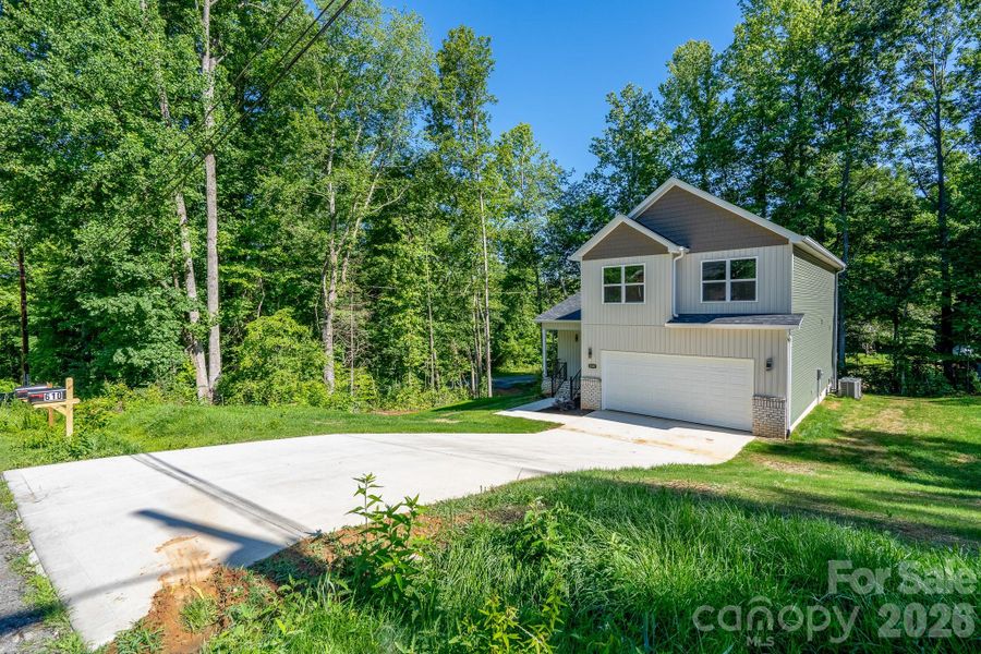 Front exterior of a new home in , Dallas, NC, highlighting curb appeal (Image 26).