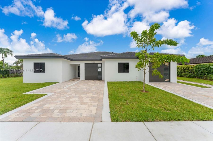 Front exterior of a new home in , Miami, FL, highlighting curb appeal (Image 27). Front exterior of a new home in , Miami, FL, highlighting curb appeal (Image 27).
