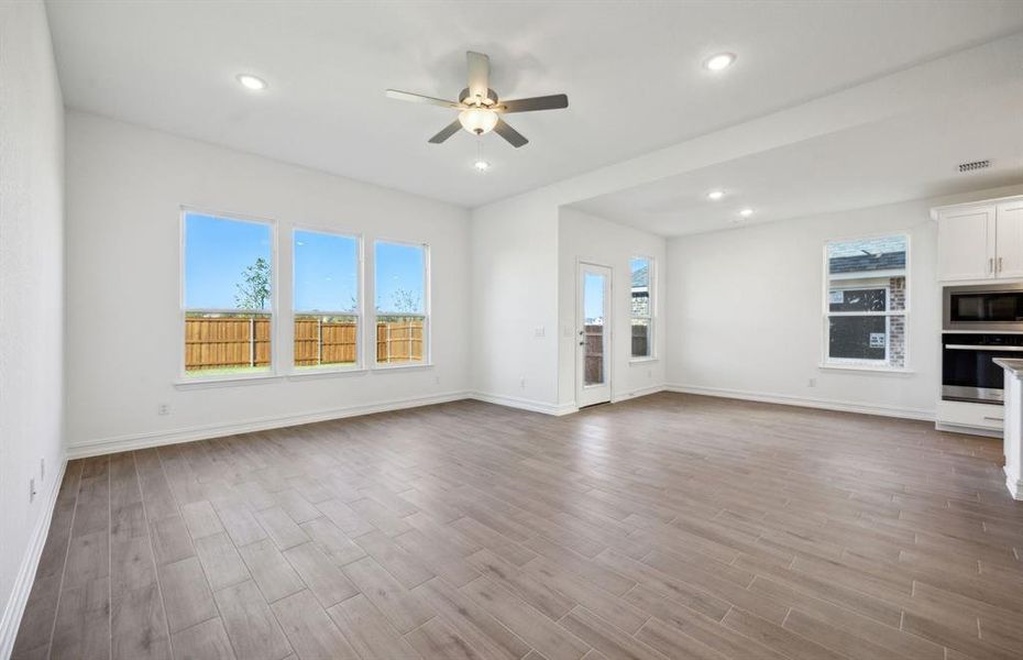 Airy gathering room with expansive windows  *real home pictured