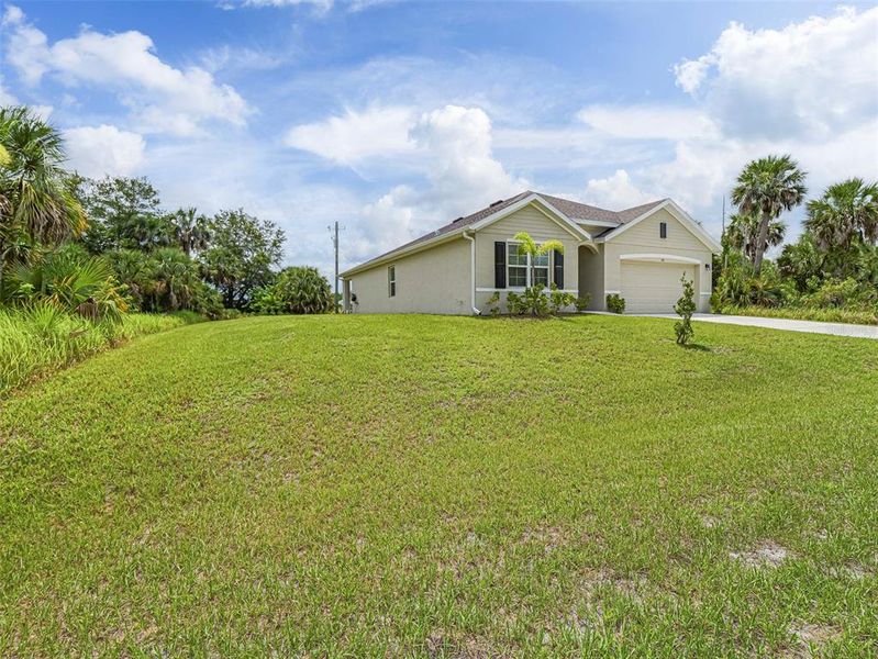 Front exterior of a new home in , Palm Bay, FL, highlighting curb appeal (Image 2). Front exterior of a new home in , Palm Bay, FL, highlighting curb appeal (Image 2).