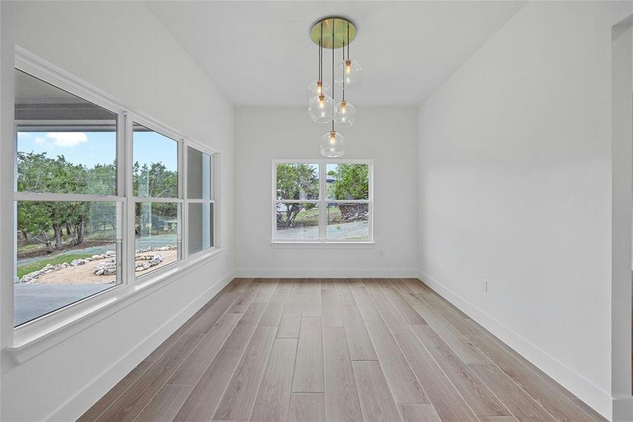 Dining room overlooking back patio and yard.