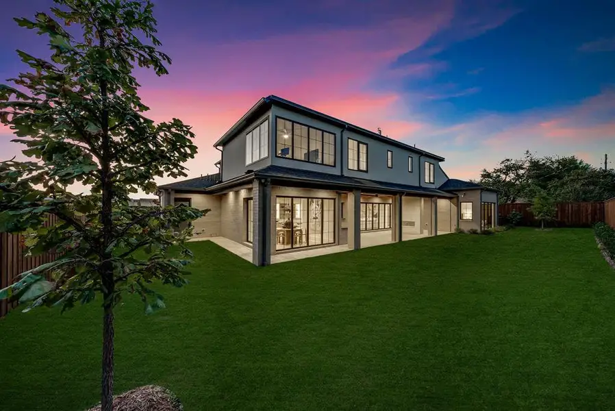 Back of house featuring a fenced backyard, a patio, and stucco siding Back of house featuring a fenced backyard, a patio, and stucco siding