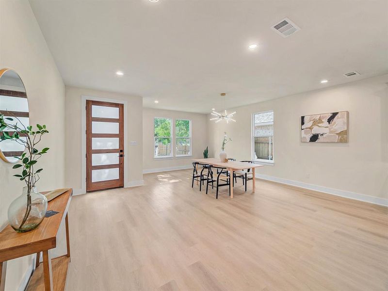 Dining room featuring a chandelier and light hardwood / wood-style floors