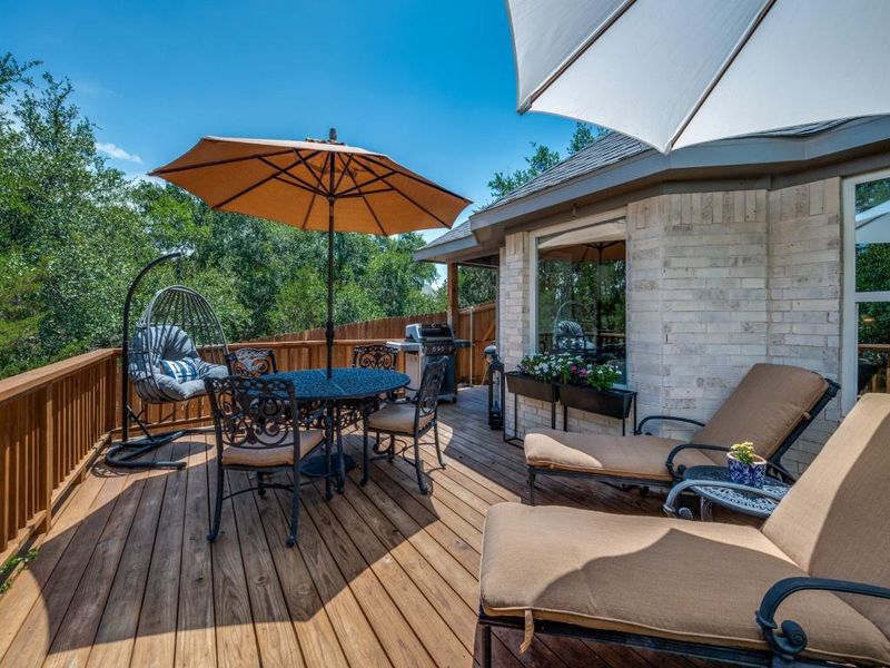 Deck with outdoor dining space and a grill Deck with outdoor dining space and a grill