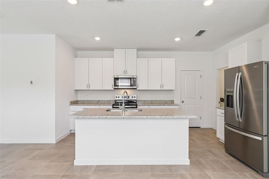 Furnished interior view inside a new home in Flagler Village - Classic Series, Palm Coast (Image 7). Furnished interior view inside a new home in Flagler Village - Classic Series, Palm Coast (Image 7).