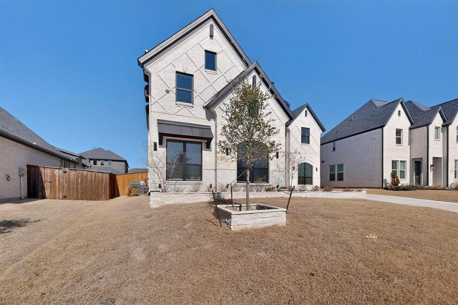 Front exterior of a new home in , Prosper, TX, highlighting curb appeal (Image 22).