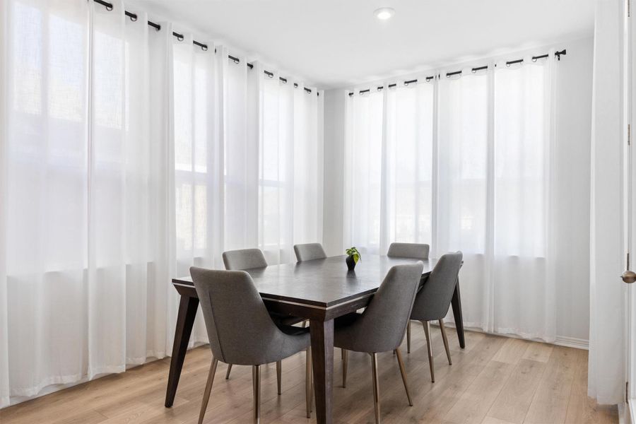 Dining space featuring light wood finished floors and recessed lighting Dining space featuring light wood finished floors and recessed lighting