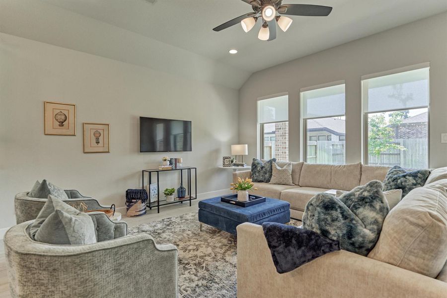 Open-concept den featuring durable wood-look tile flooring.