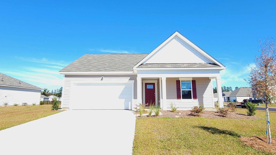 Front exterior of a new home in Jordanville Farms, Galivants Ferry, SC, highlighting curb appeal (Image 1).