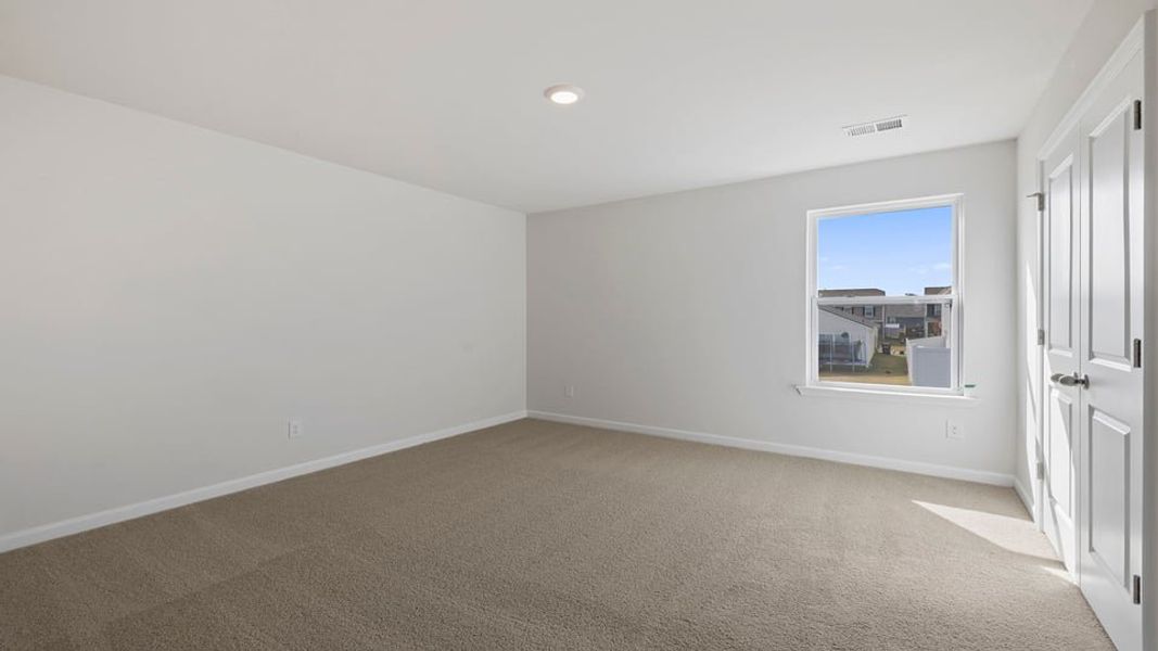 Spacious, unfurnished interior of a new home in Durbin Meadows Traditions, Fountain Inn (Image 25).