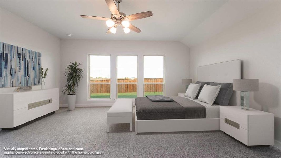 Bedroom with ceiling fan and lofted ceiling