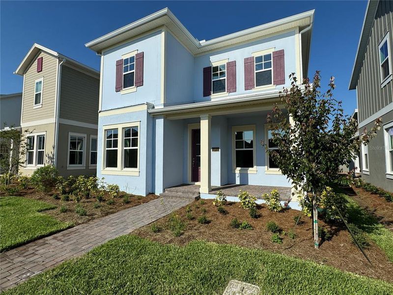 Front exterior of a new home in , Orlando, FL, highlighting curb appeal (Image 26).