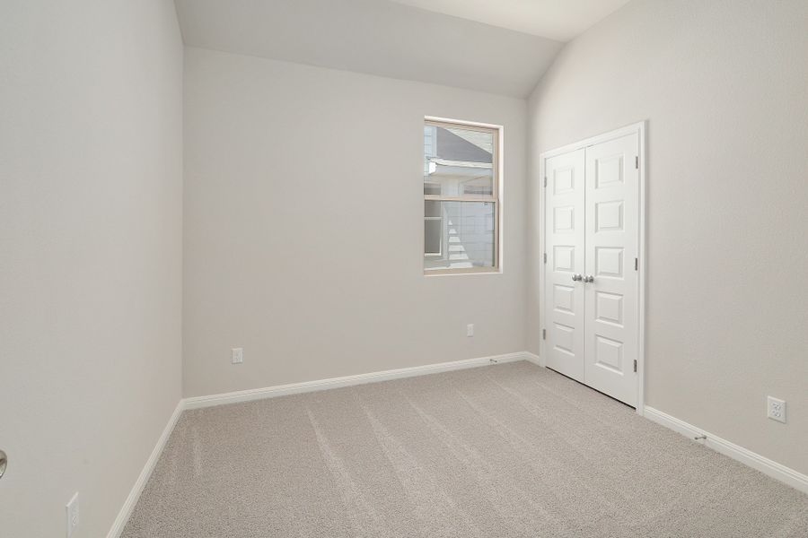 Bedroom in the Ash home plan by Trophy Signature Homes – REPRESENTATIVE PHOTO
