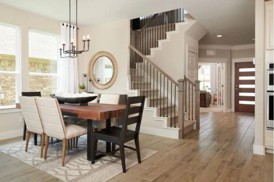 Photo of Pulte model home with same floor plan, not of actual home listed.