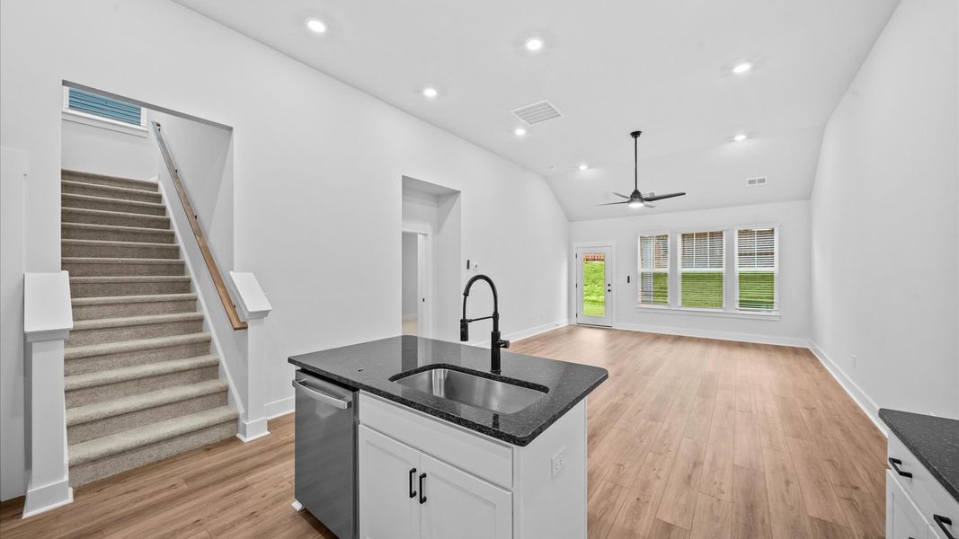 Vibrant kitchen layout with a center island, refined finishes, and open-concept flow Vibrant kitchen layout with a center island, refined finishes, and open-concept flow