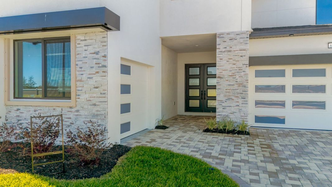 The Front Door of a DRB Homes Grand Hawk which is offered as a home plan at Serengeti in Spring Hill, FL.