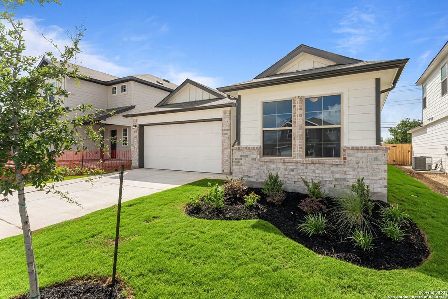 Front exterior of a new home in Meadows at Clear Springs, New Braunfels, TX, highlighting curb appeal (Image 1). Front exterior of a new home in Meadows at Clear Springs, New Braunfels, TX, highlighting curb appeal (Image 1).