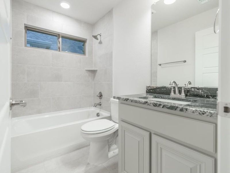 Tile to the ceiling in bath tub of second bath Tile to the ceiling in bath tub of second bath