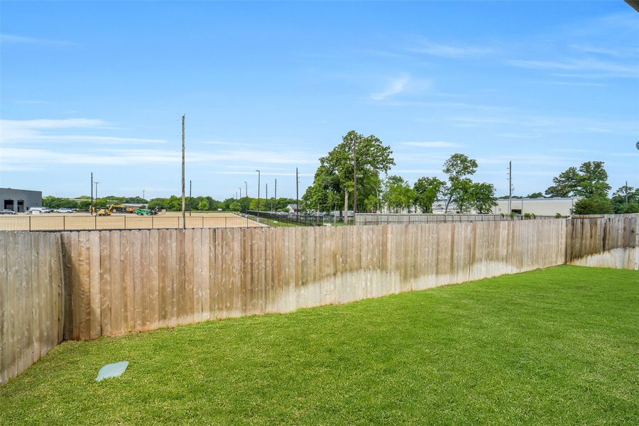 Exterior details and patio area of a home in Windmill Estates, Magnolia (Image 31).