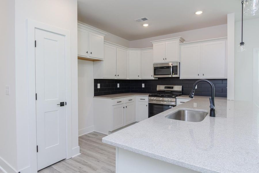 Representative furnished interior of a home built from the 1692 Townhome by Adams Homes in Parkstone Place Townhomes, Roebuck (Image 5).