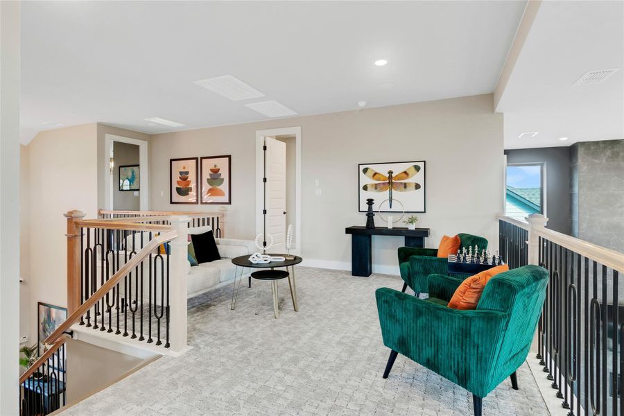 Sitting room with an upstairs landing and recessed lighting Sitting room with an upstairs landing and recessed lighting