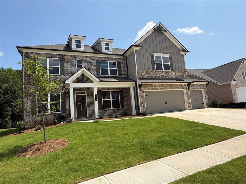 Front exterior of a new home in Ponderosa Farms Manor, Gainesville, GA, highlighting curb appeal (Image 27). Front exterior of a new home in Ponderosa Farms Manor, Gainesville, GA, highlighting curb appeal (Image 27).