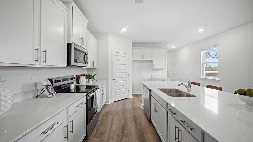 Representative furnished interior of a home built from the Hemingway-Exp by D.R. Horton in The Lakes at North Glynn, Brunswick (Image 8).