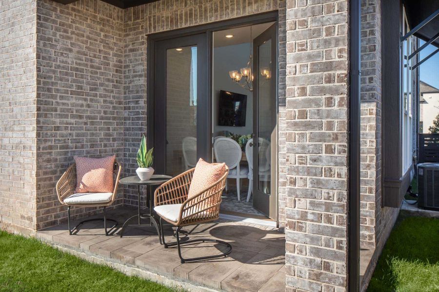 Representative exterior details of a home built from the Derby Plan by Highland Homes in Bridgeland Central: The Cottages, Cypress (Image 1).