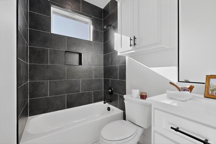 Full bath featuring vanity and shower / washtub combination Full bath featuring vanity and shower / washtub combination