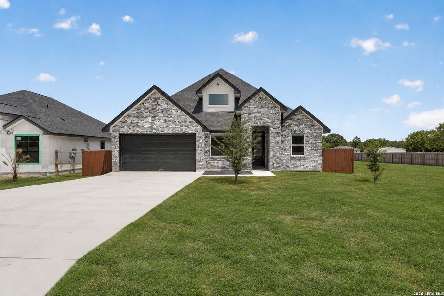 Front exterior of a new home in , Somerset, TX, highlighting curb appeal (Image 21).