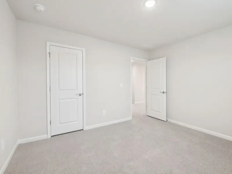 Spacious, unfurnished interior of a new home in Country Lane - Signature Series, Clayton (Image 19).
