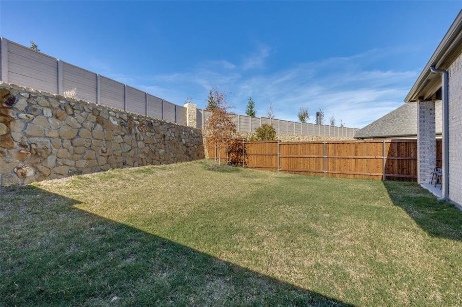 View of fenced backyard