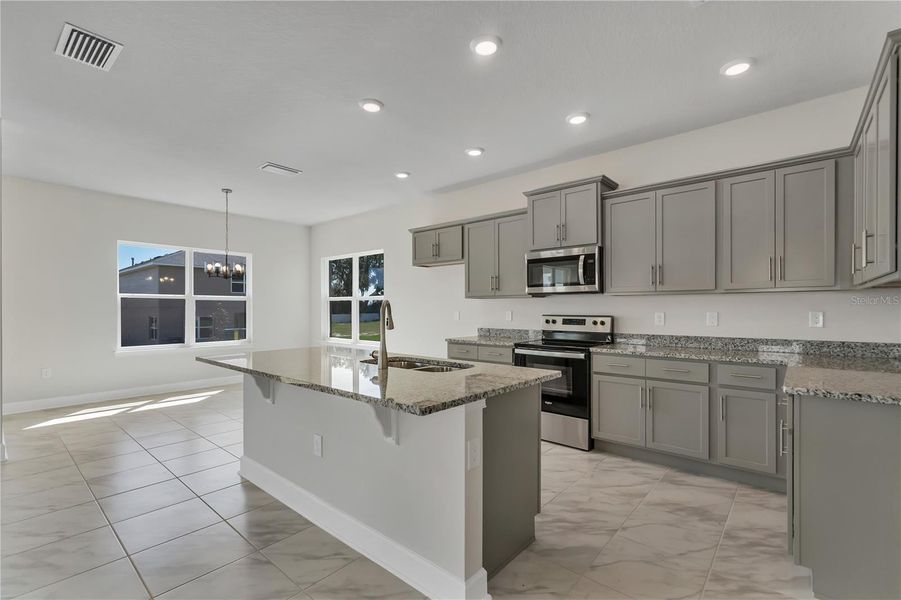 Representative furnished interior of a home built from the 2202- by Adams Homes in Winding Oaks, Weeki Wachee (Image 5).