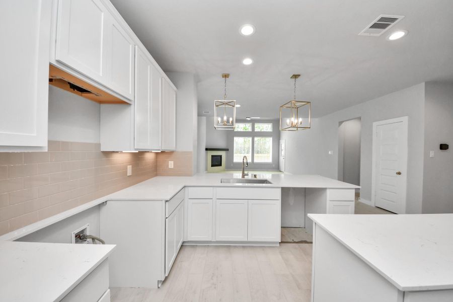 All of this overlooks your expansive family room, creating a perfect space for culinary delights and family gatherings.