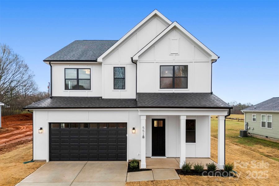 Front exterior of a new home in , Troutman, NC, highlighting curb appeal (Image 28). Front exterior of a new home in , Troutman, NC, highlighting curb appeal (Image 28).