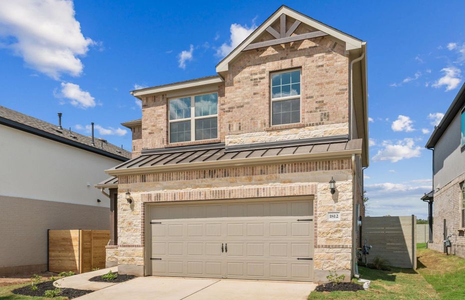 Front exterior of a new home in Wolf Ranch, Georgetown, TX, highlighting curb appeal (Image 16).