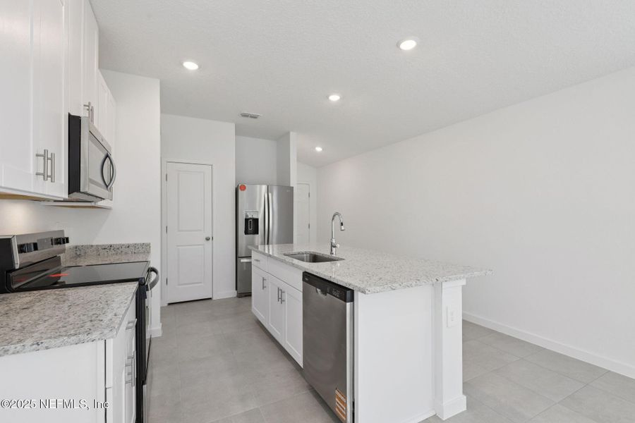 Furnished interior view inside a new home in Flagler Village - Classic Series, Palm Coast (Image 9).