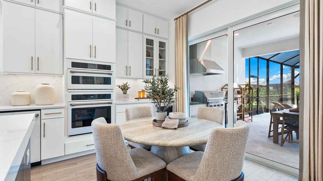 Furnished interior view inside a new home in Esplanade by the Islands, Naples (Image 11).