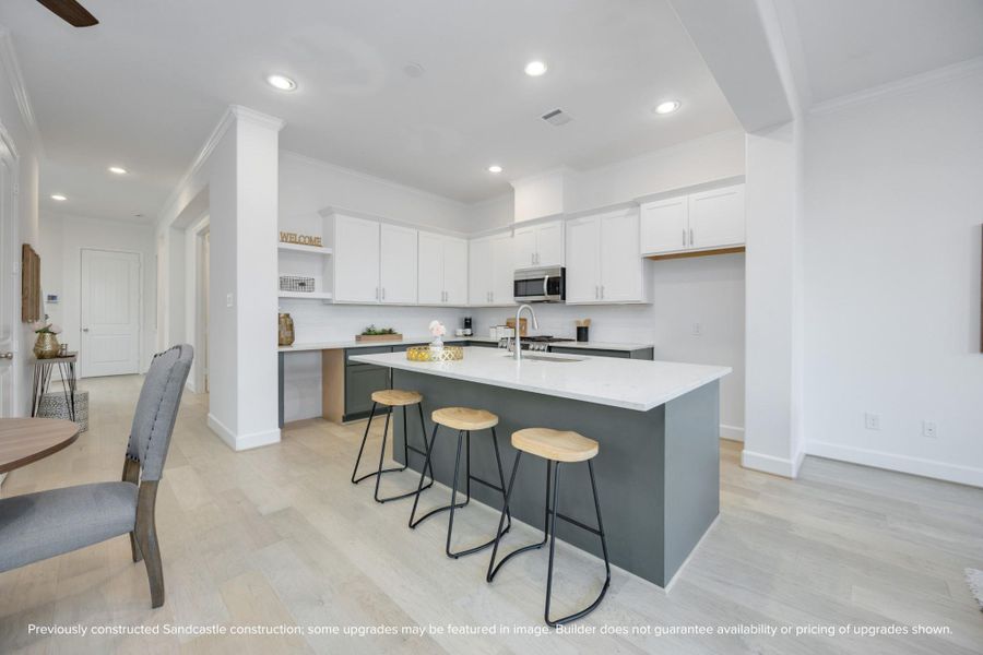 Zoom in on the beauty: crisp cabinetry, statement lighting, and luxurious quartz countertops—each detail curated to blend function and flair.