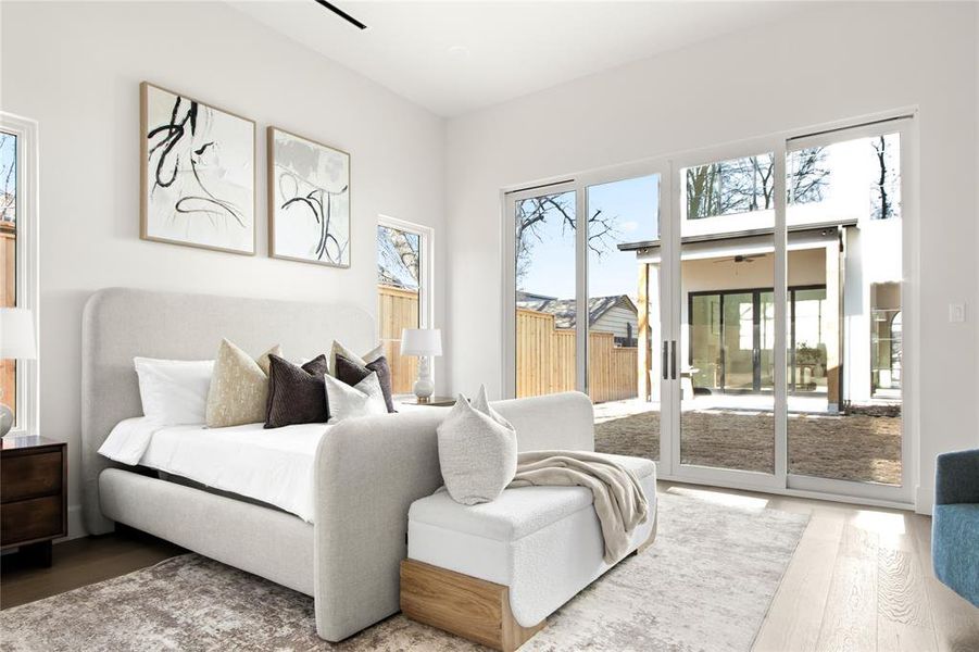 Spacious interior featuring light wood-finish flooring, white walls, and a recessed ceiling light